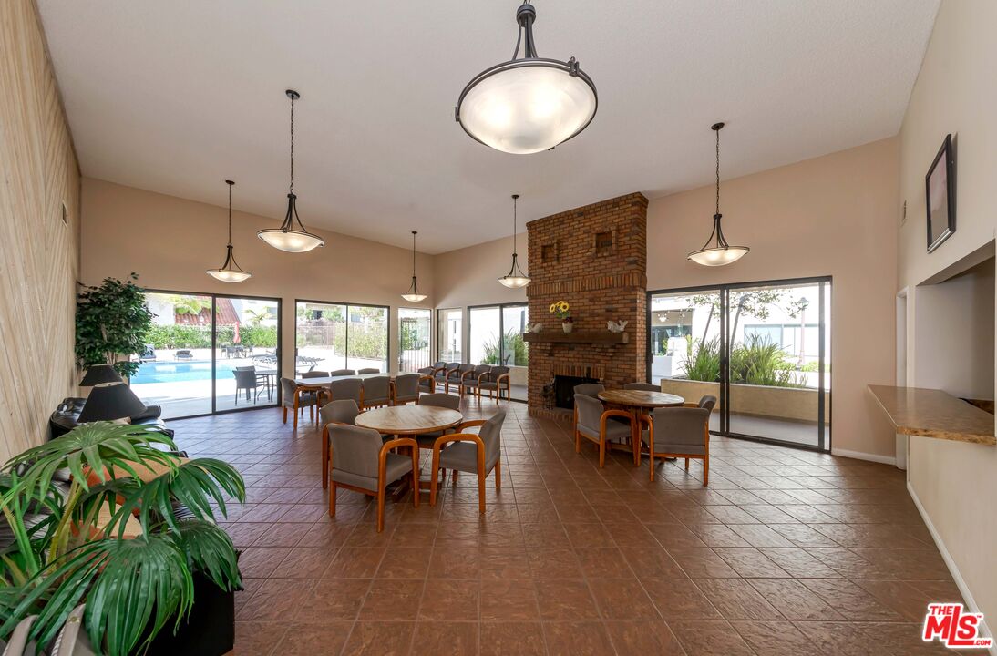 8180 Manitoba Street, Unit 248 Playa del Rey, CA 90293 - Photo 33 of 40 a view of a dining room and livingroom with furniture wooden floor a chandelier