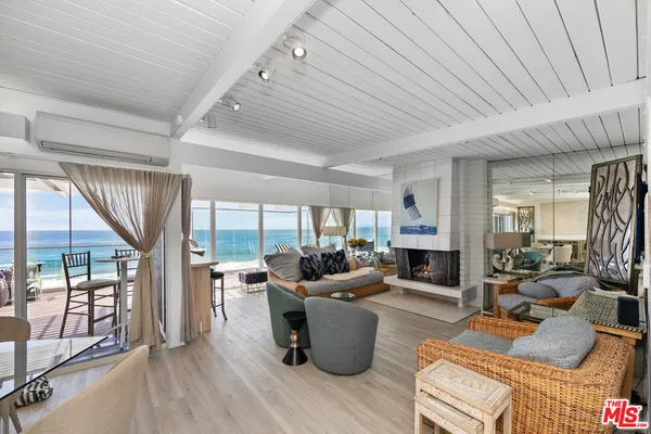 a living room with furniture or outdoor view and a large window