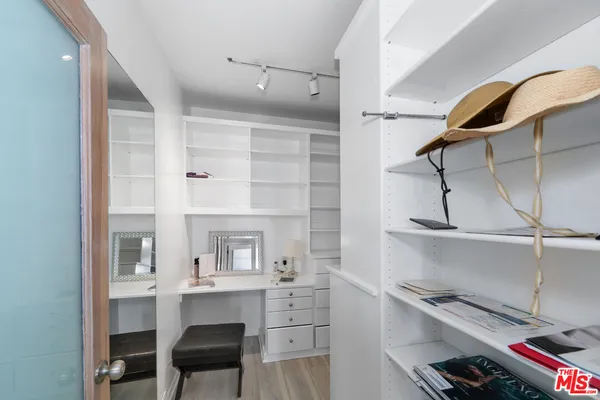 a room with cabinets and wooden floor