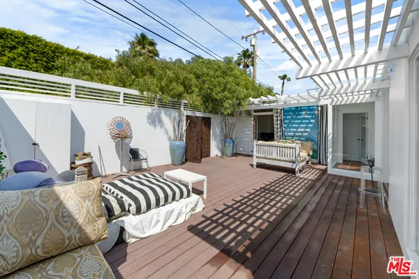 a view of a balcony with furniture