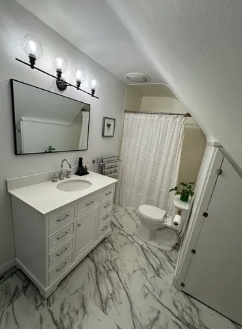a bathroom with a double vanity sink and mirror