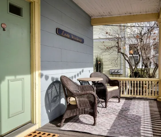 a bedroom with furniture and a window