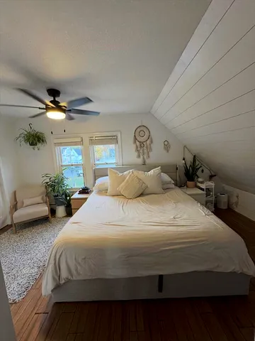 a bedroom with bed and window