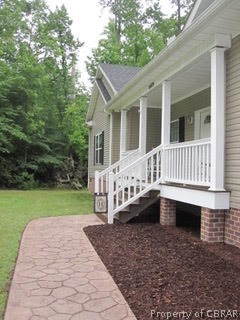 8409 Indian Road Gloucester, VA 23061 - Photo 17 of 24 PORCH AND STAMPED WALKWAY