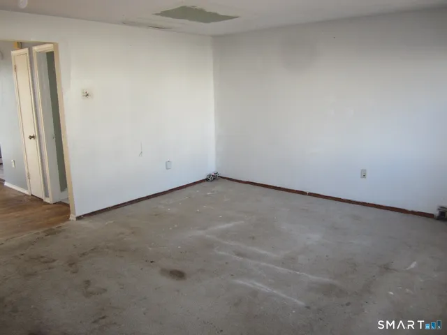 an empty room with a bench