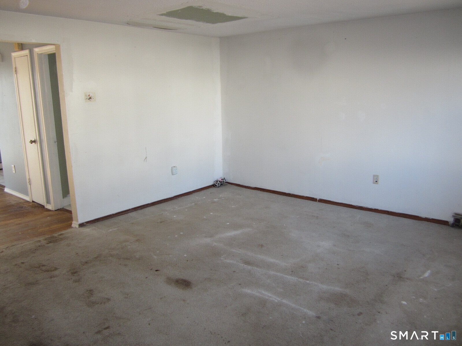 37 Graham Road East Hartford, CT 06118 - Photo 14 of 26 an empty room with a bench