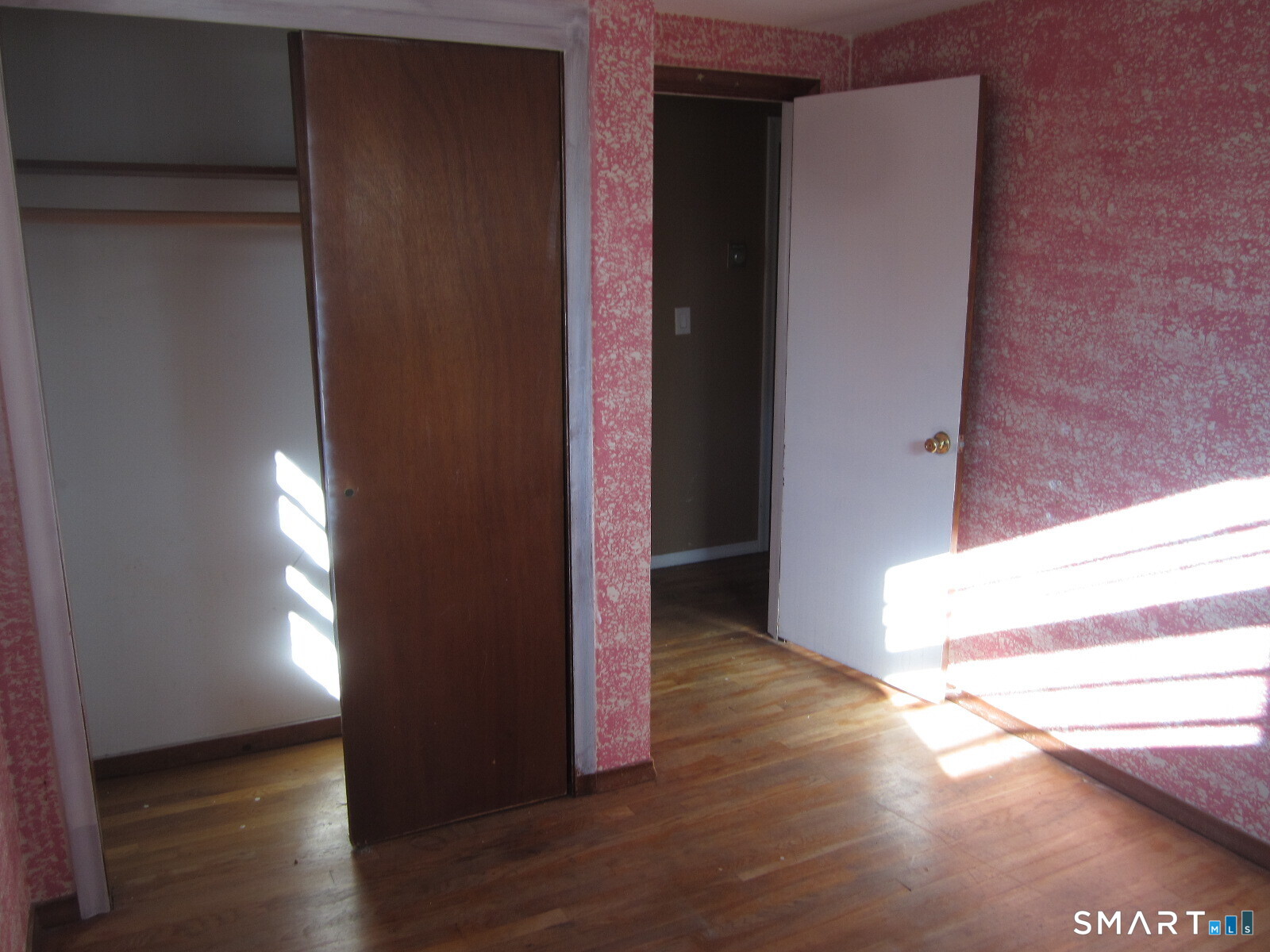 37 Graham Road East Hartford, CT 06118 - Photo 22 of 26 a view of entryway and hall with wooden floor