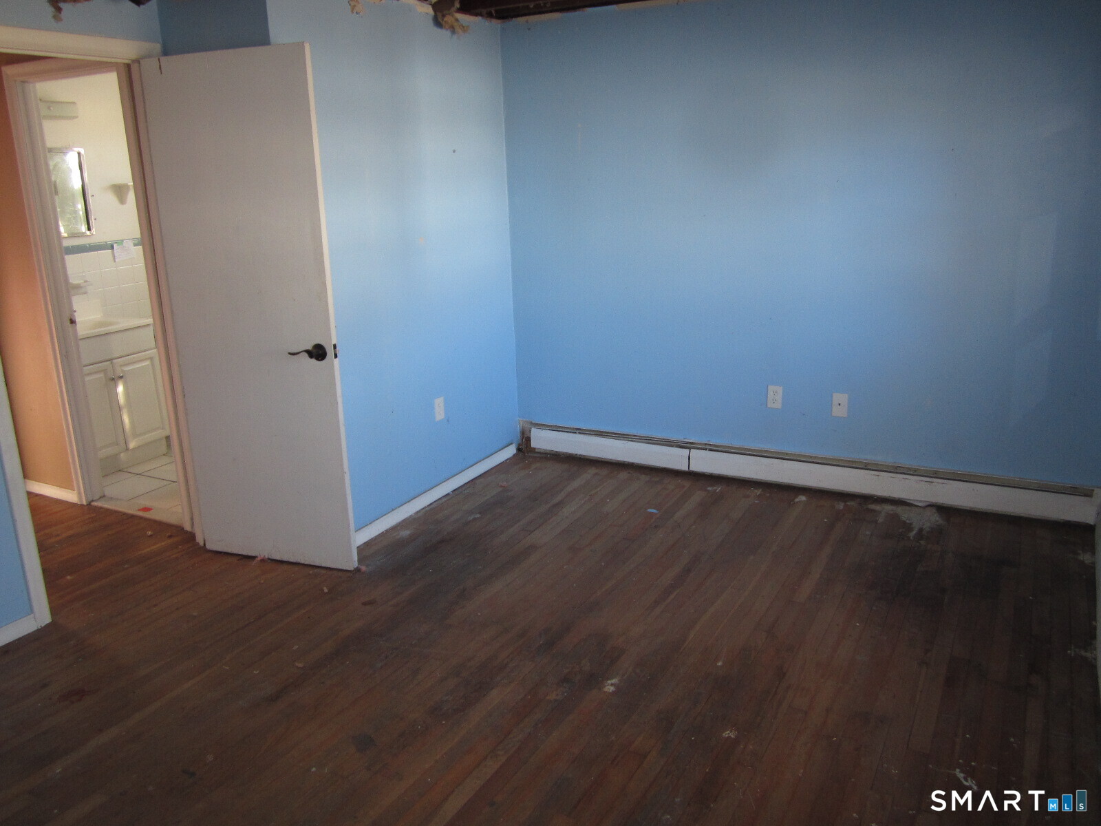37 Graham Road East Hartford, CT 06118 - Photo 26 of 26 an empty room with wooden floor and windows