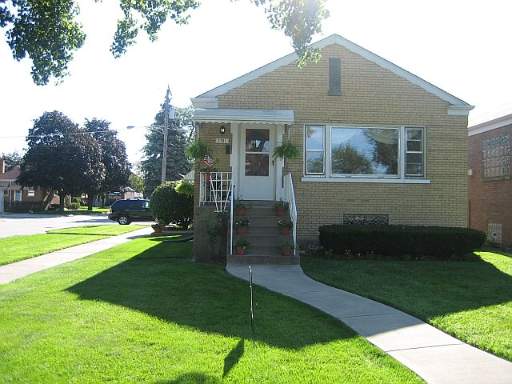2301 Keystone Avenue North Riverside, IL 60546 - Photo 1 of 1 a front view of house with yard and green space