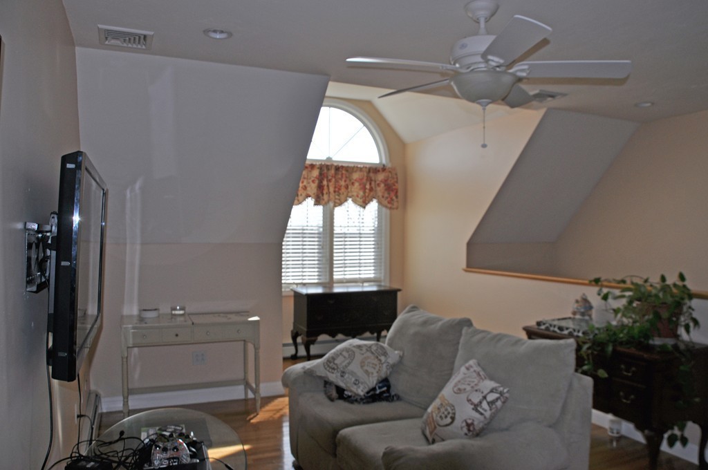 174 Chace Hill Road Sterling, MA 01564 - Photo 18 of 30 a living room with furniture and a window