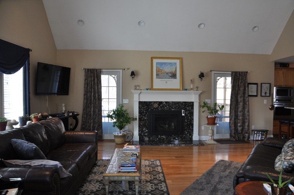174 Chace Hill Road Sterling, MA 01564 - Photo 8 of 30 a living room with furniture and a fireplace