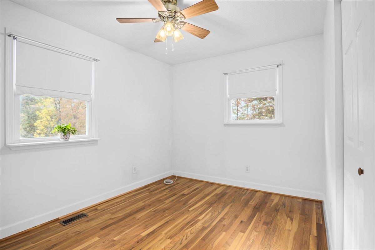 9508 Koontz Corner Road Harrisonburg, VA 22802 - Photo 28 of 55 a view of room with window and wooden floor