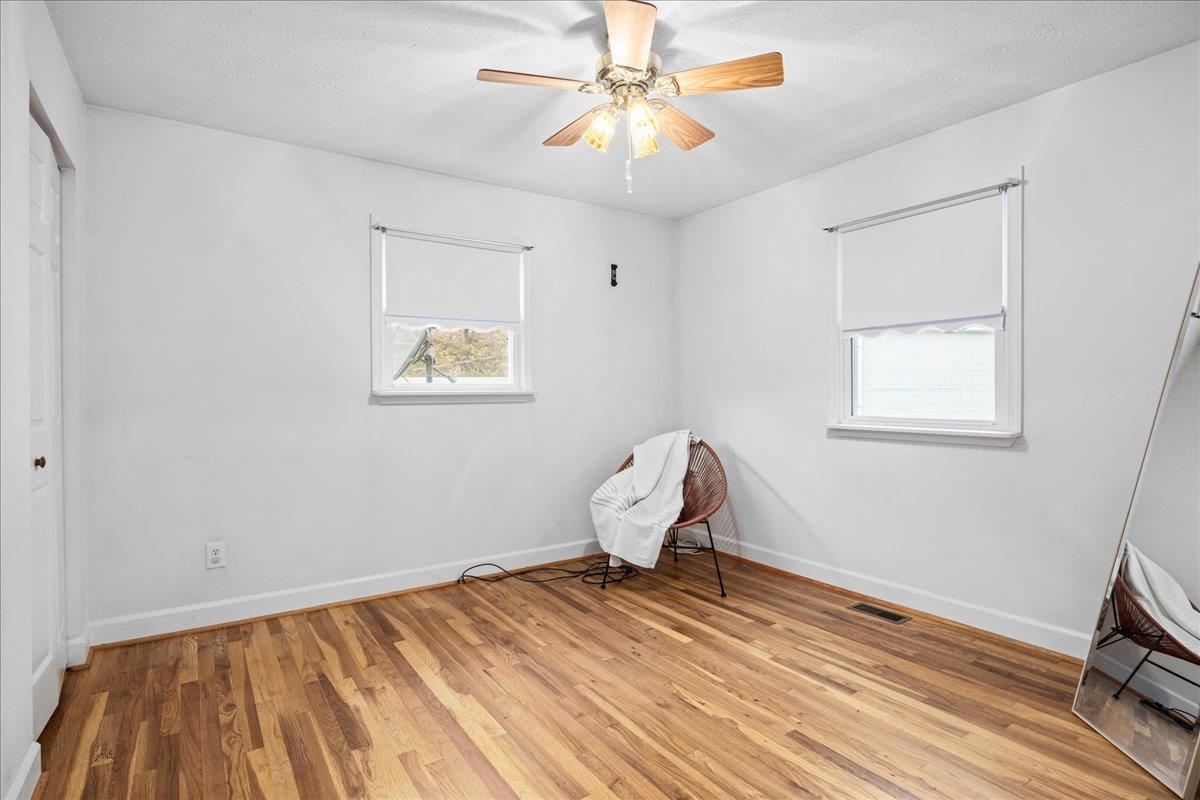 9508 Koontz Corner Road Harrisonburg, VA 22802 - Photo 29 of 55 a bedroom with a bed and a chandelier