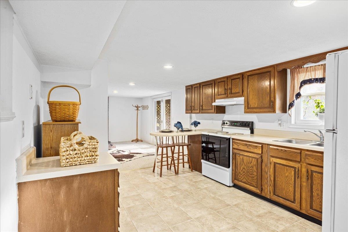 9508 Koontz Corner Road Harrisonburg, VA 22802 - Photo 32 of 55 a large kitchen with stainless steel appliances granite countertop a stove and a sink