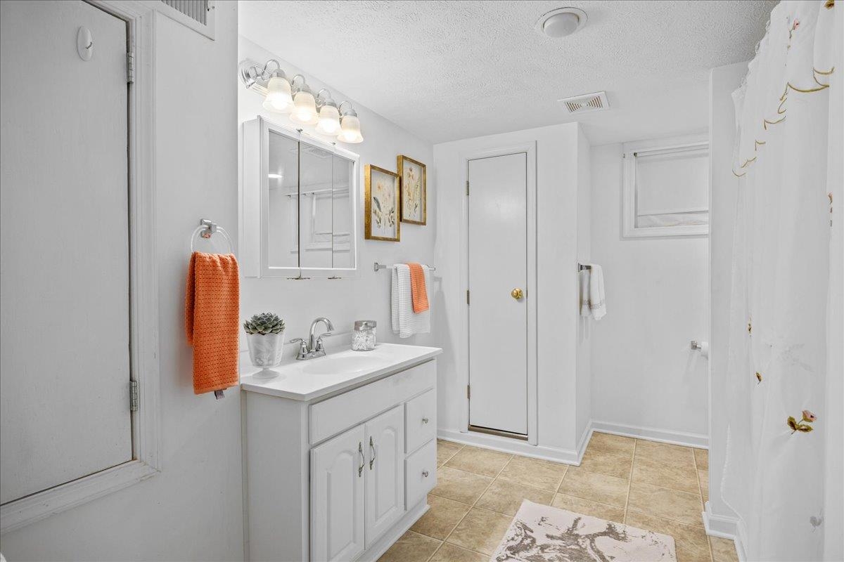 9508 Koontz Corner Road Harrisonburg, VA 22802 - Photo 37 of 55 a bathroom with a sink and a mirror