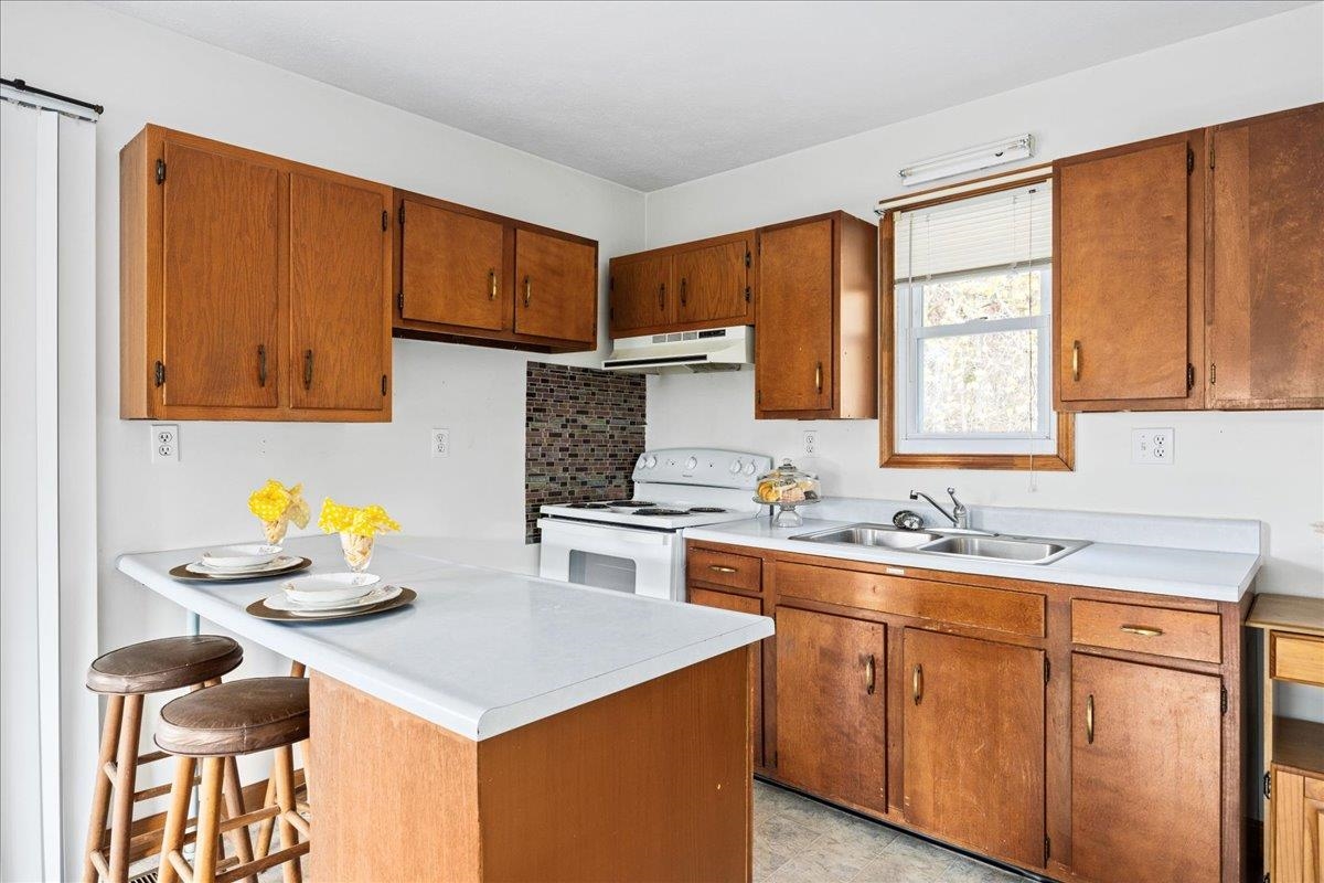 9508 Koontz Corner Road Harrisonburg, VA 22802 - Photo 44 of 55 a kitchen with stainless steel appliances granite countertop a sink stove and cabinets