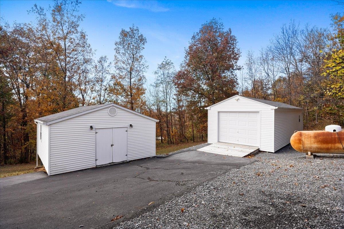 9508 Koontz Corner Road Harrisonburg, VA 22802 - Photo 52 of 55 a view of a house with a yard and garage