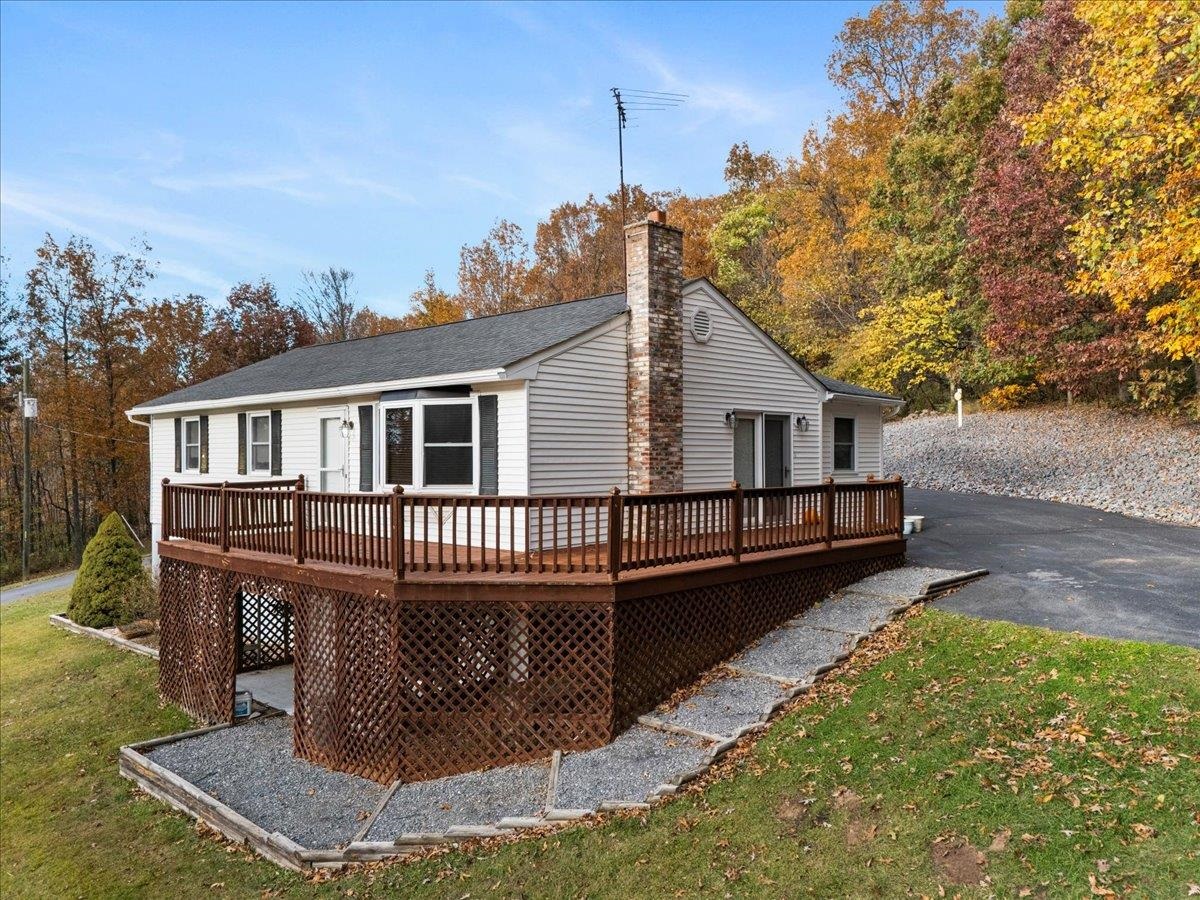 9508 Koontz Corner Road Harrisonburg, VA 22802 - Photo 7 of 55 a view of a house with a wooden deck and a yard