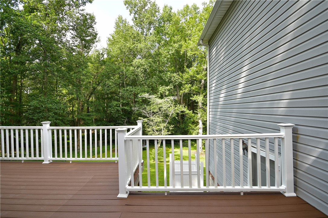 197 Deer Creek Road Easley, SC 29640 - Photo 44 of 50 A spacious wooden deck provides a tranquil overlook of a lush, tree-filled landscape.
