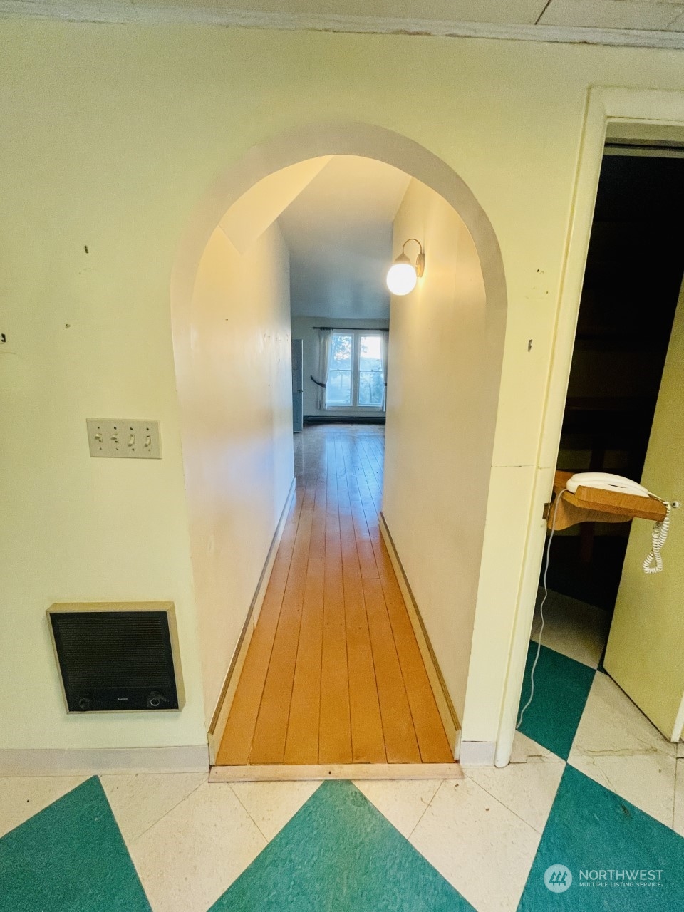 1912 Tucannon Road Pomeroy, WA 99347 - Photo 5 of 13 a view of a hallway with wooden floor and staircase