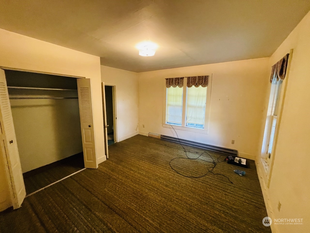 1912 Tucannon Road Pomeroy, WA 99347 - Photo 6 of 13 a view of a room with wooden floor and window