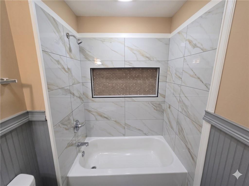 1929 Wee Kirk Road Southeast Atlanta, GA 30316 - Photo 14 of 22 a bathroom with a sink and a bathtub