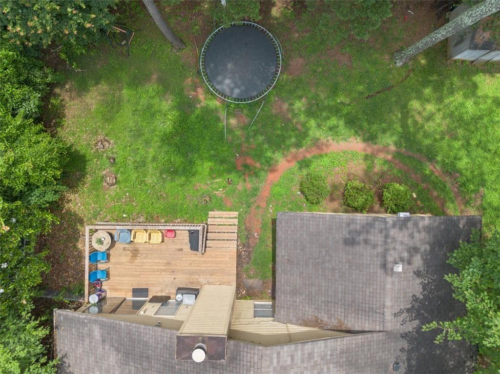 5016 Comanche Court Northwest Lilburn, GA 30047 - Photo 12 of 13 an outdoor space with furniture and garden