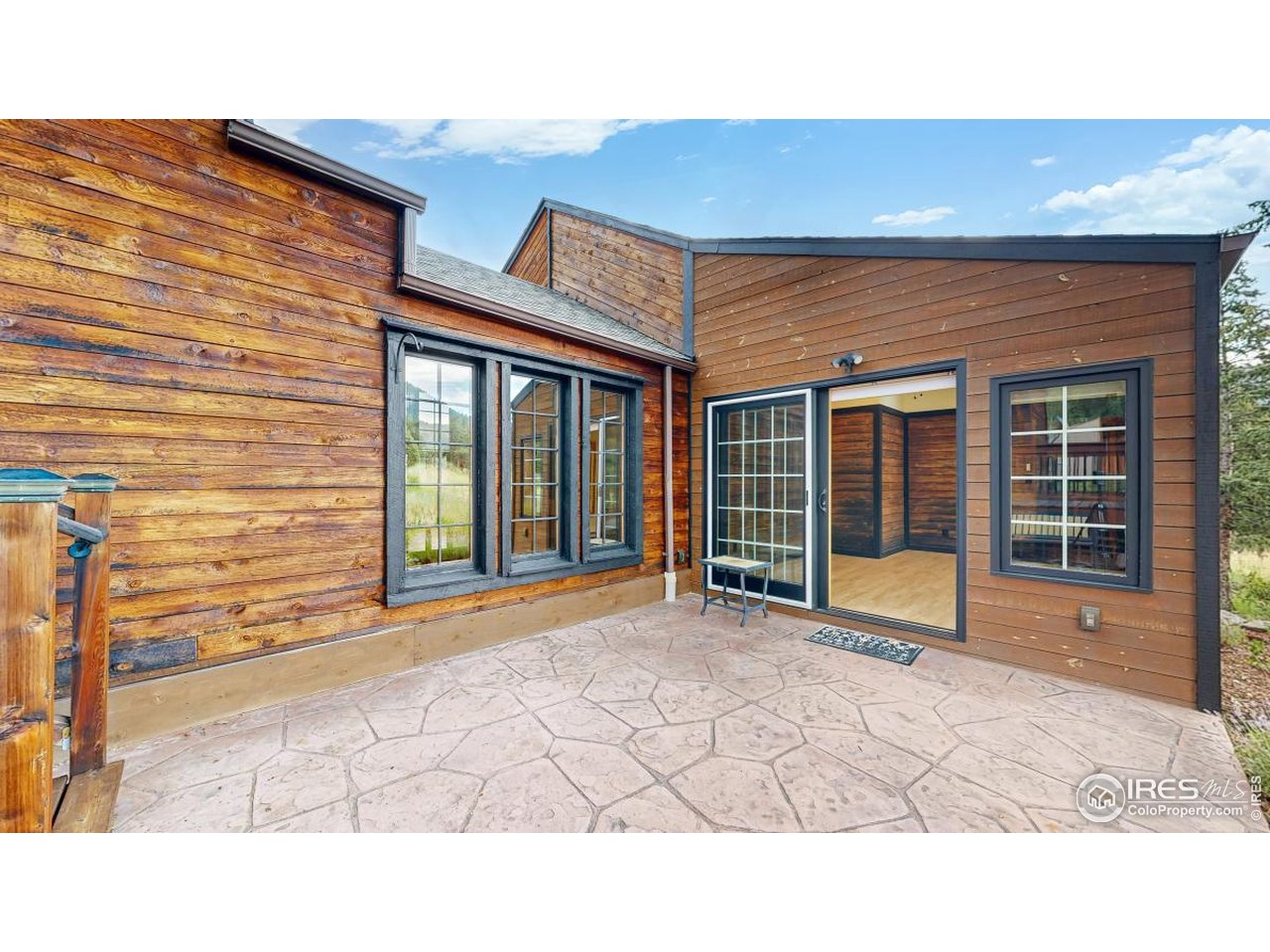 253 Apache Road Lyons, CO 80540 - Photo 23 of 32 Sunroom Patio Access