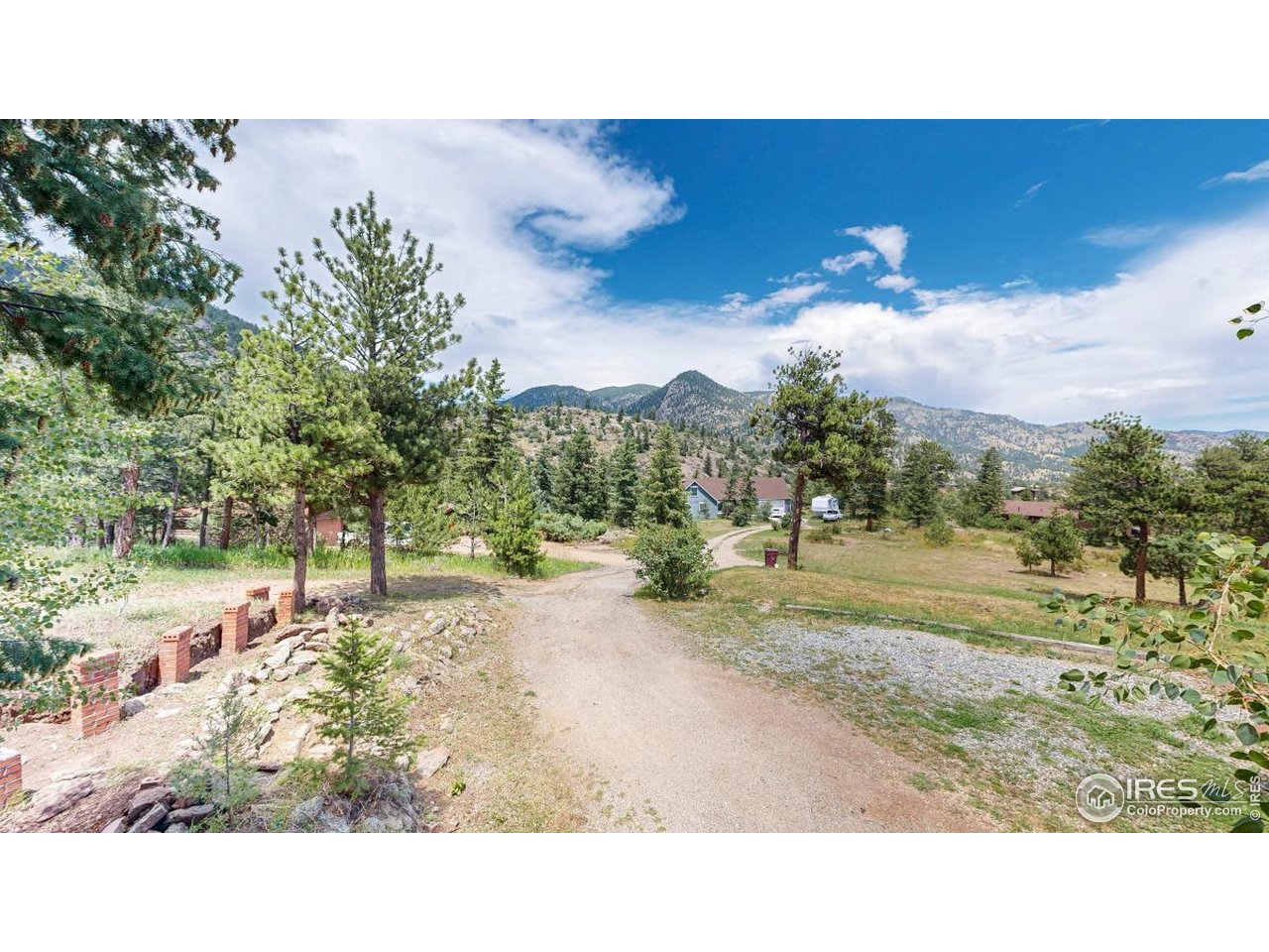 253 Apache Road Lyons, CO 80540 - Photo 25 of 32 Tree Lined Driveway