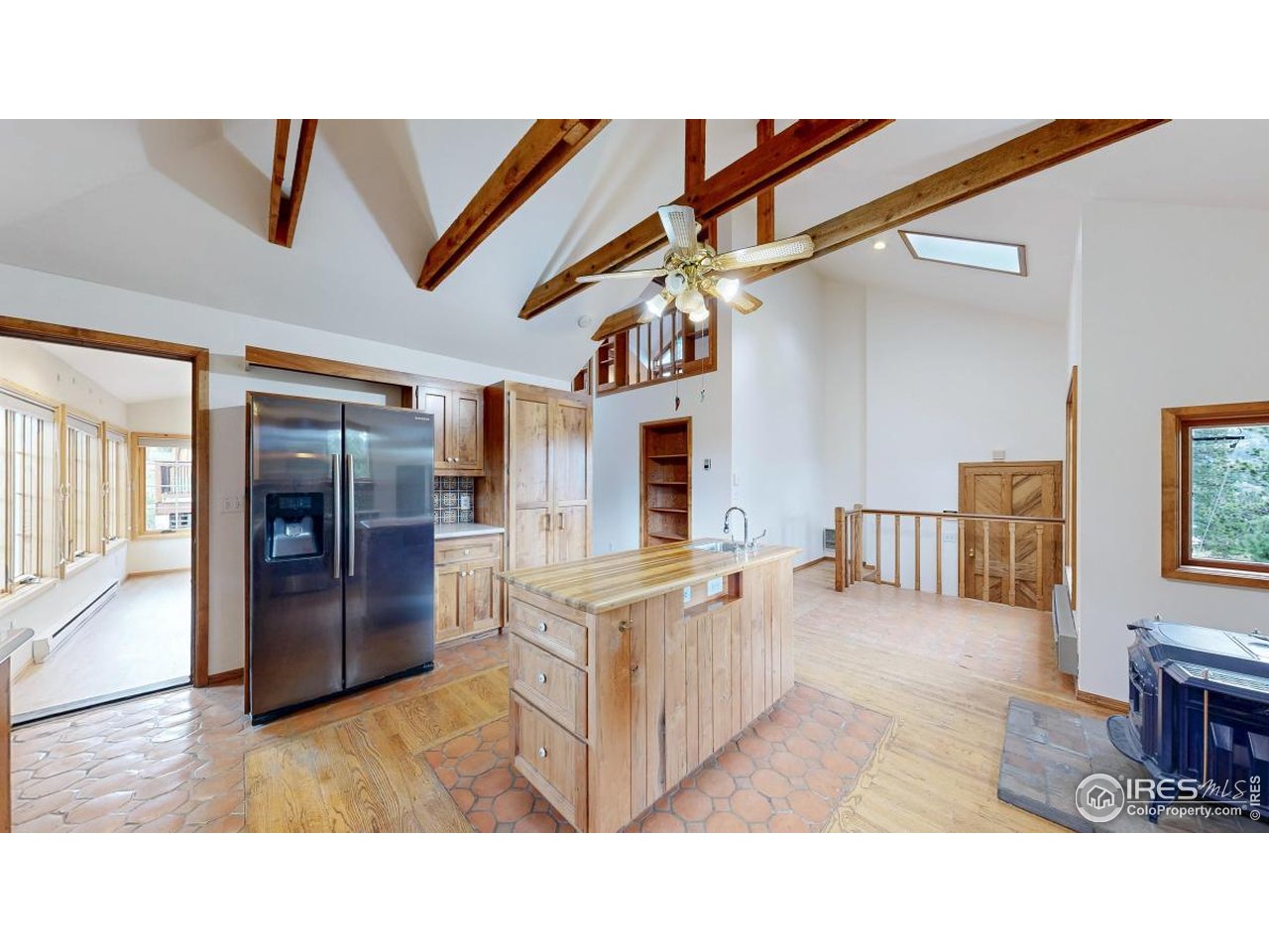 253 Apache Road Lyons, CO 80540 - Photo 8 of 32 Left of Refrigerator is Sunroom