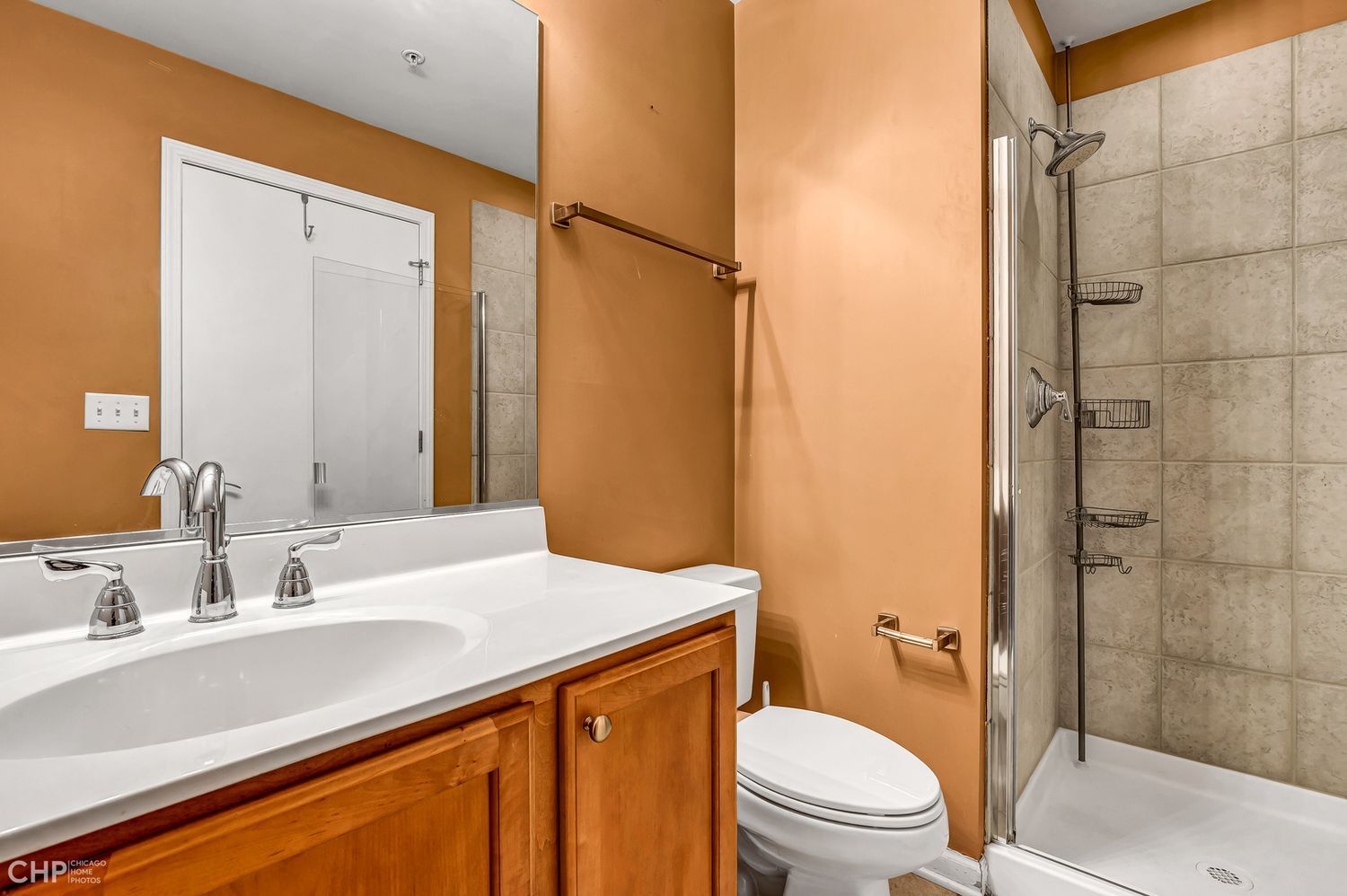 1717 South Prairie Avenue, Unit 1403 Chicago, IL 60616 - Photo 17 of 41 a bathroom with a sink toilet vanity and shower