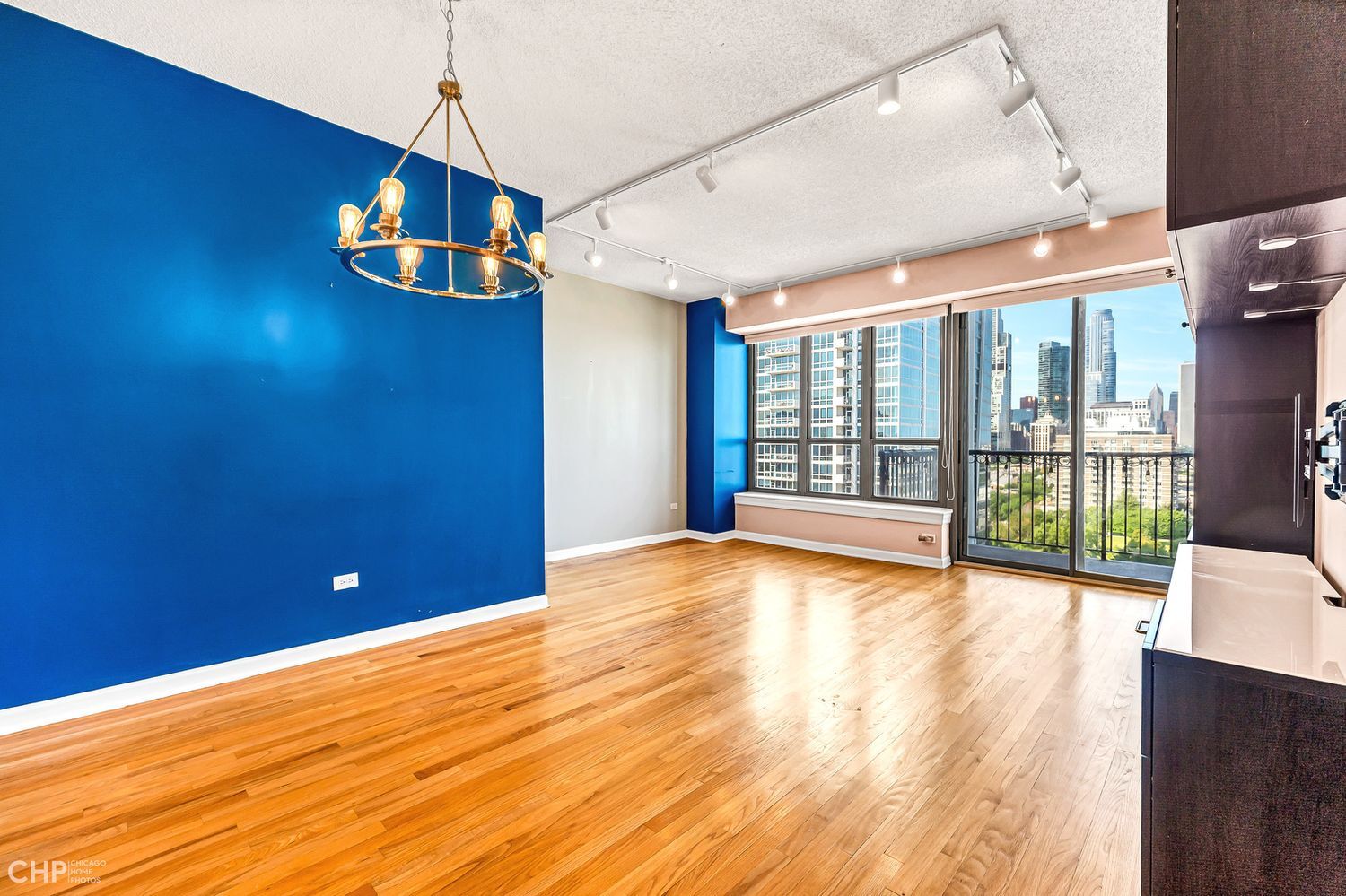 1717 South Prairie Avenue, Unit 1403 Chicago, IL 60616 - Photo 2 of 41 a view of empty room with wooden floor and fan