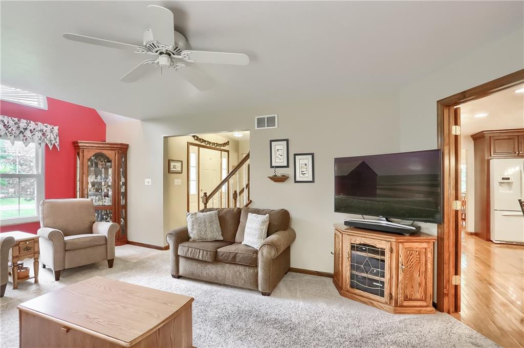 233 Foxglove Road Baden, PA 15005 - Photo 14 of 25 A neutrally tones family room features a custom ceiling with palladium window.