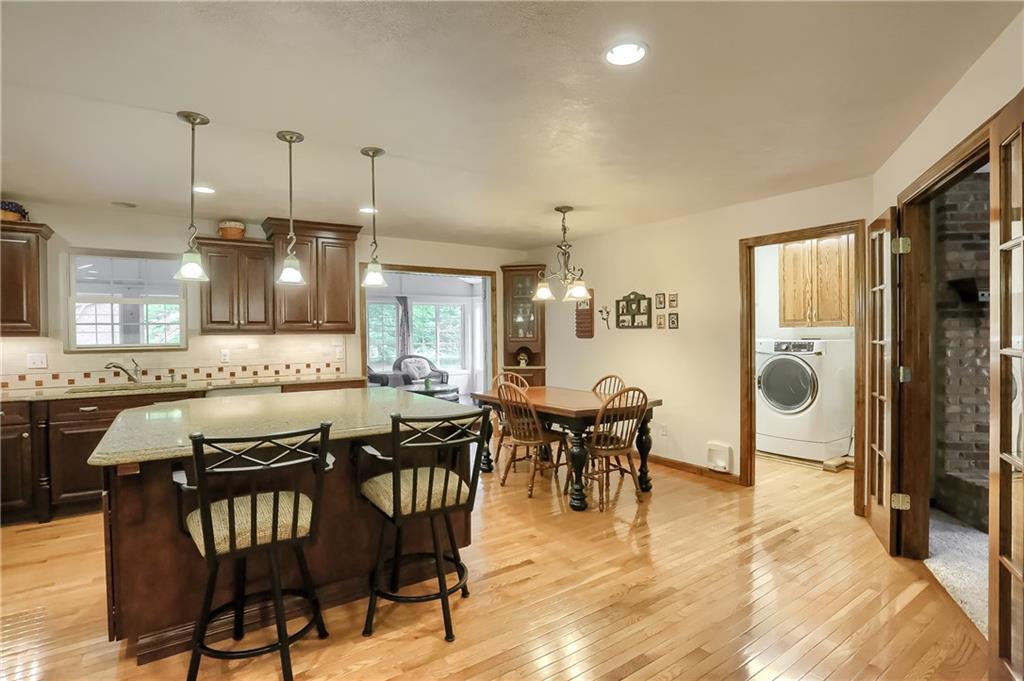 Access to the dining room, the 3 season room, the expansive laundry room and French door access to the family room are all provided here in the heart of the home.  