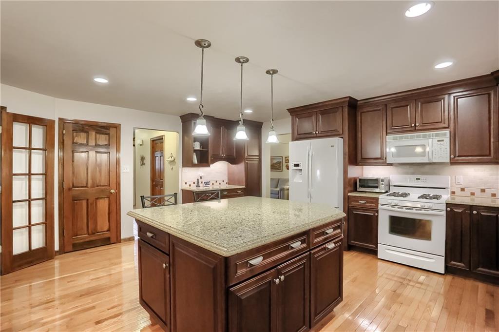 233 Foxglove Road Baden, PA 15005 - Photo 8 of 25 Meal prep and clean up is a breeze in the well equipped kitchen with endless counter space.
