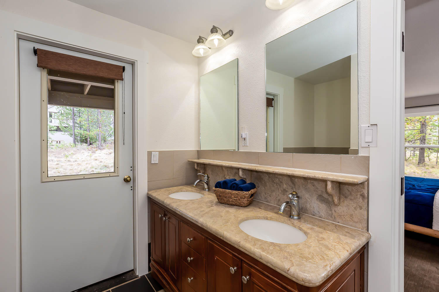 57781 Blue Goose Lane, Unit 4 Sunriver, OR 97707 - Photo 22 of 36 Tub/shower combo, accessible via the hallway or 2nd guest room, and opens to the lower patio/hot tub area