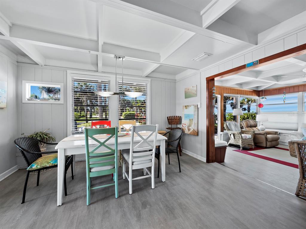 1620 Casey Key Road Nokomis, FL 34275 - Photo 11 of 49 a view of a dining room with furniture window and wooden floor