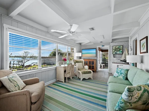 a view of living room with furniture and floor to ceiling window