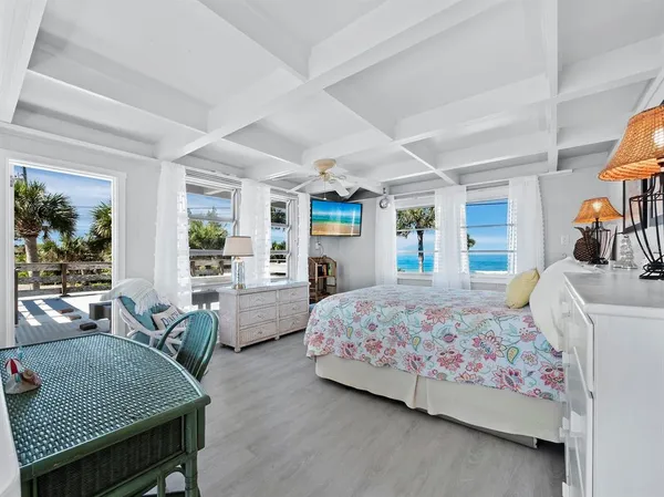 a bedroom with a bed and a dresser in it