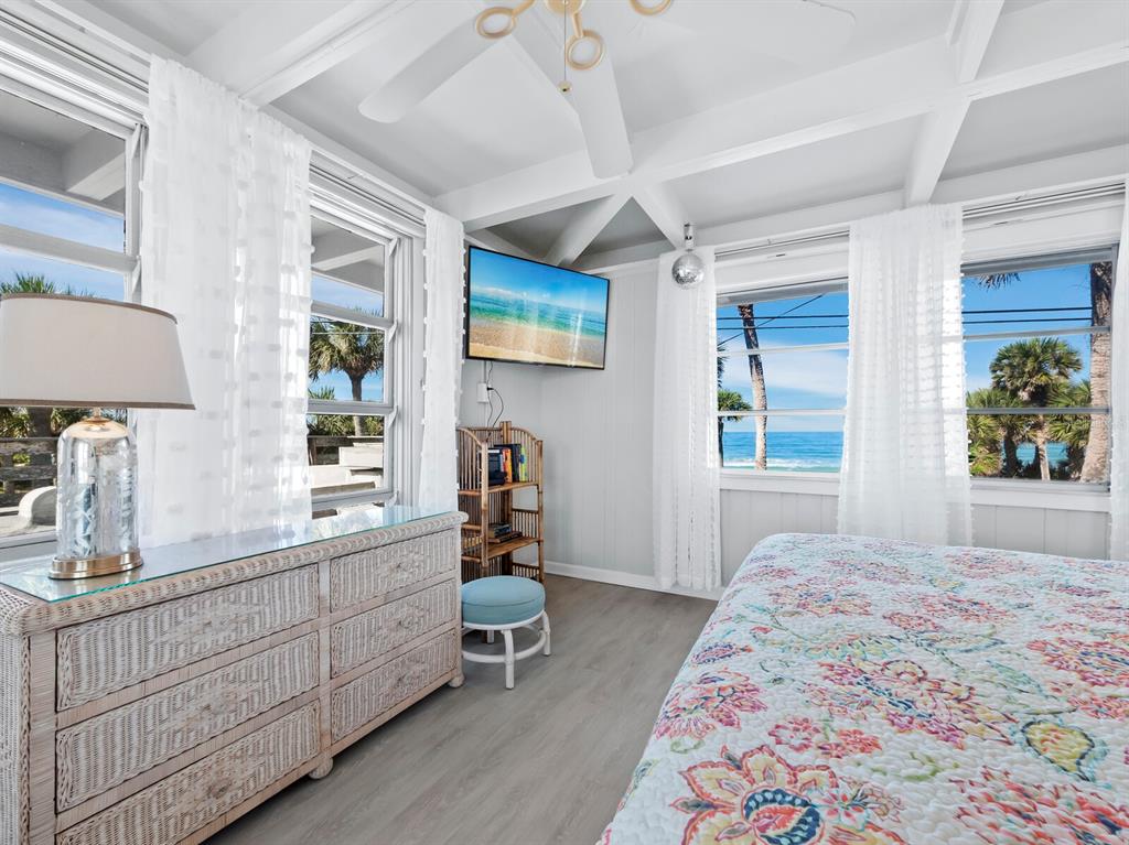 1620 Casey Key Road Nokomis, FL 34275 - Photo 22 of 49 a bedroom with furniture and a window