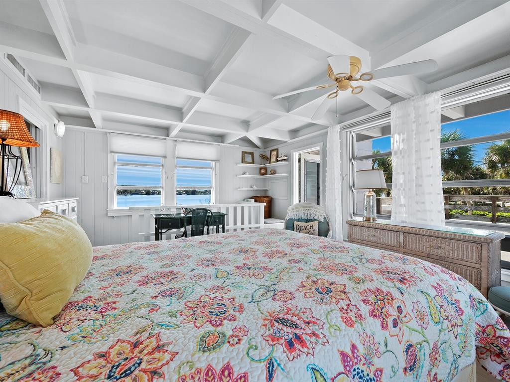 1620 Casey Key Road Nokomis, FL 34275 - Photo 24 of 49 a bedroom with a large bed and a large window