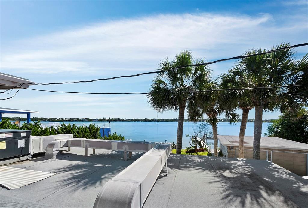 1620 Casey Key Road Nokomis, FL 34275 - Photo 29 of 49 a view of roof deck with palm trees