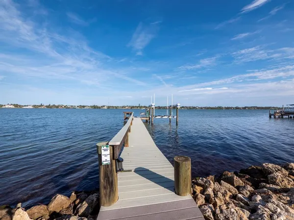 a view of a balcony with seating space