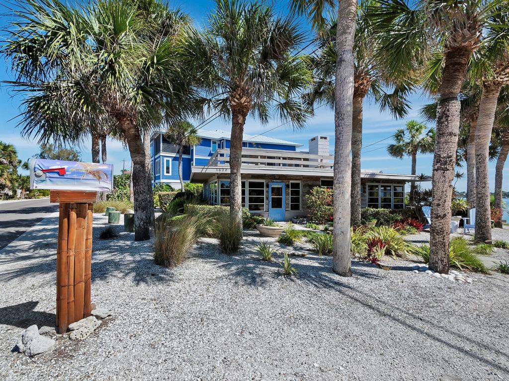 1620 Casey Key Road Nokomis, FL 34275 - Photo 40 of 49 a view of a house with backyard and sitting area