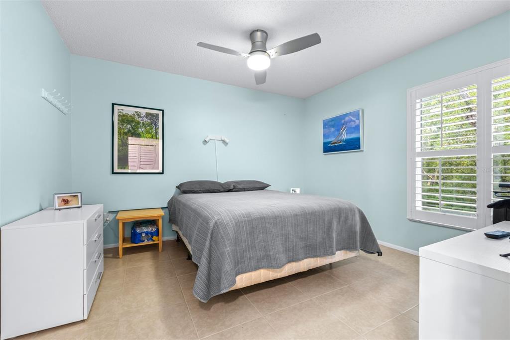 1250 South Pinellas Avenue, Unit 711 Tarpon Springs, FL 34689 - Photo 16 of 33 a bedroom with a bed and a window