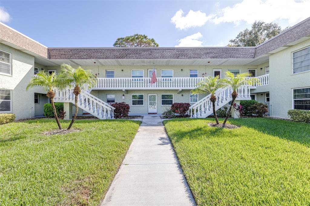 1250 South Pinellas Avenue, Unit 711 Tarpon Springs, FL 34689 - Photo 2 of 33 a view of an chairs in front of house