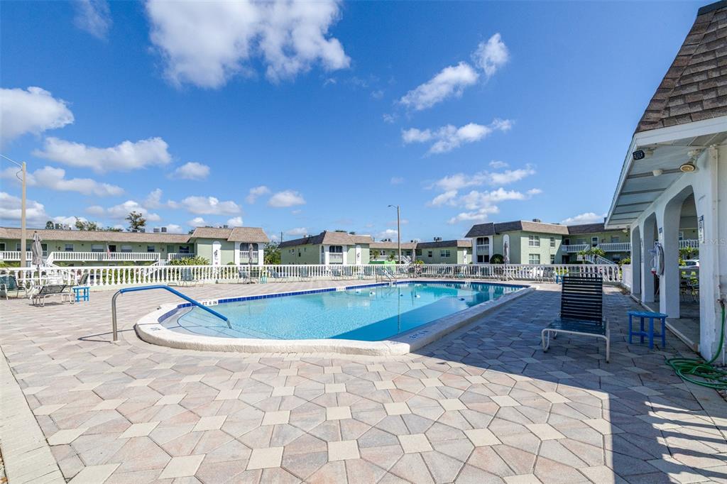 1250 South Pinellas Avenue, Unit 711 Tarpon Springs, FL 34689 - Photo 21 of 33 a view of a swimming pool and lounge chair