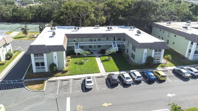an aerial view of a house with swimming pool