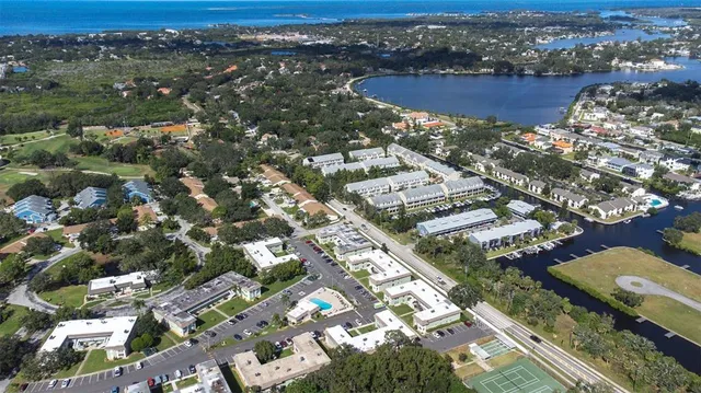 an aerial view of residential houses with outdoor space