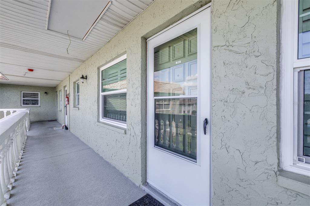 1250 South Pinellas Avenue, Unit 711 Tarpon Springs, FL 34689 - Photo 4 of 33 a view of hallway with livingroom